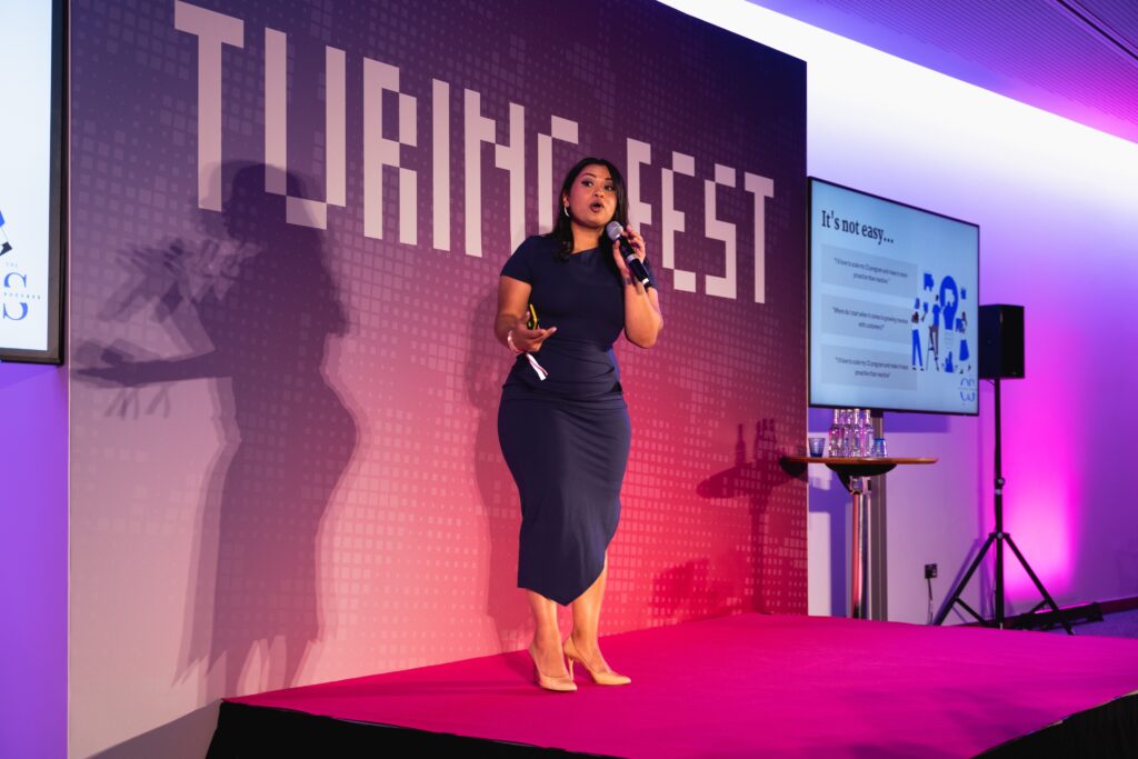 Anika Zubair speaking at Turingfest 2023 about customer success for revene Growth